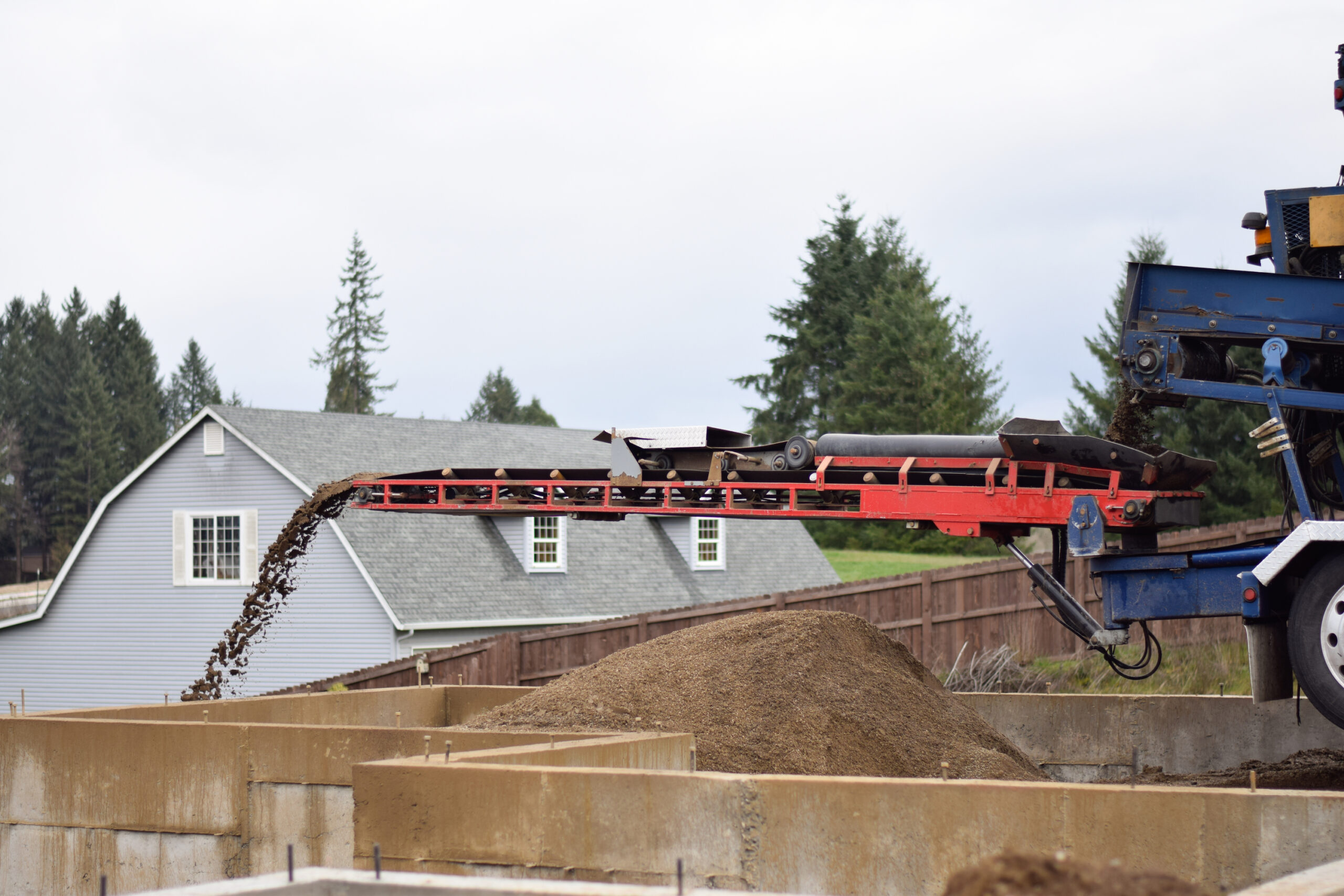 Breaking Ground Conveyor Services completing a soil delivery project